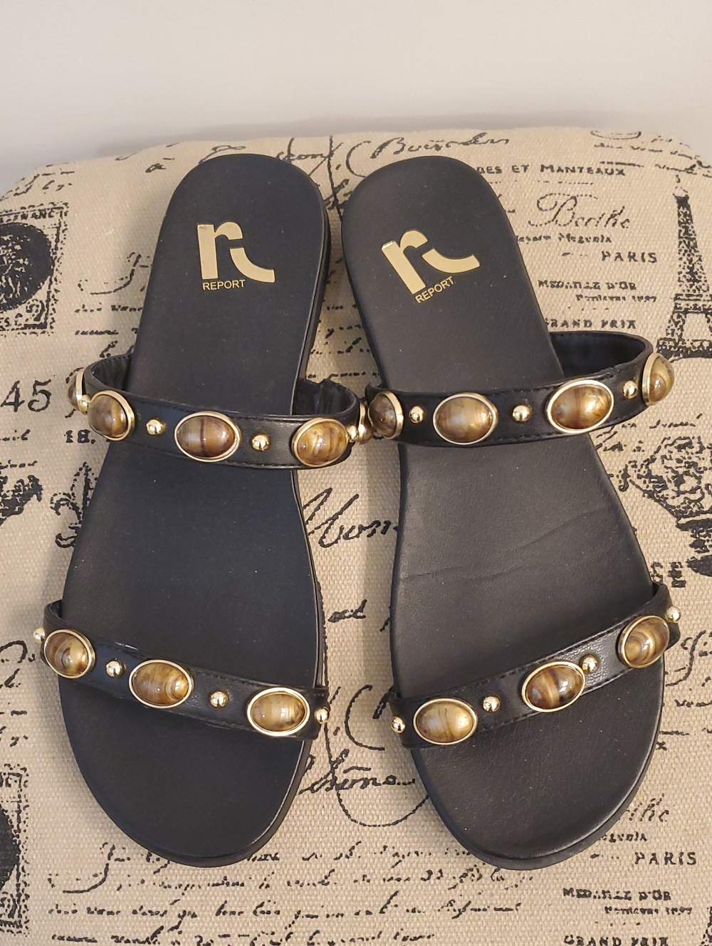 Report Black Slide Sandals with Gold-Tone Oval Accents